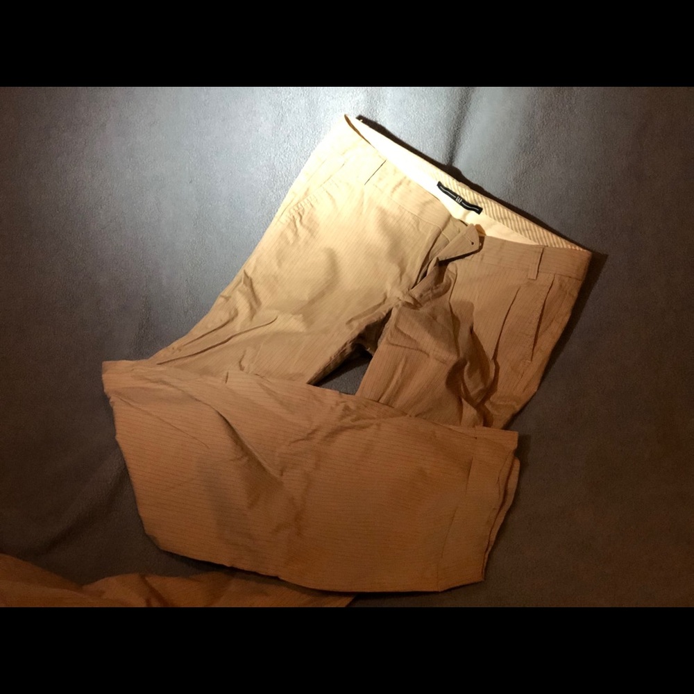 Long, striped tan trousers